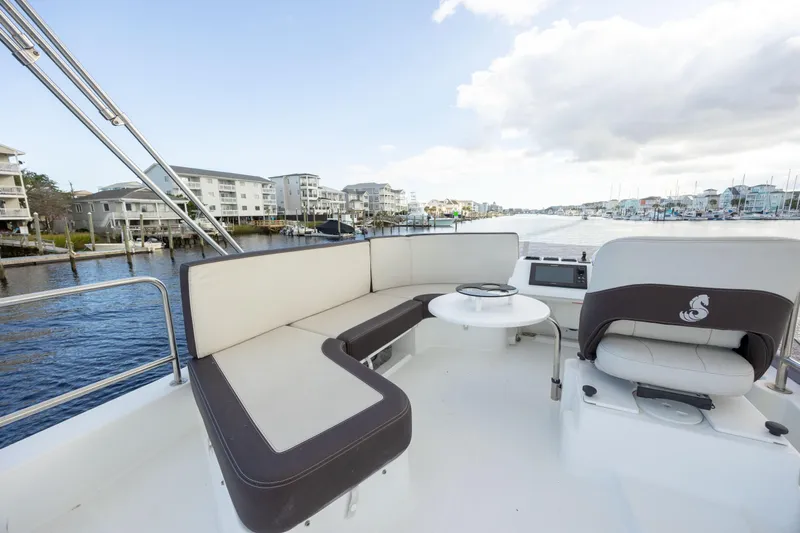 Smooth Yacht Photos Pics 2019 Beneteau Swift Trawler 30, spacious deck seating with marina view.