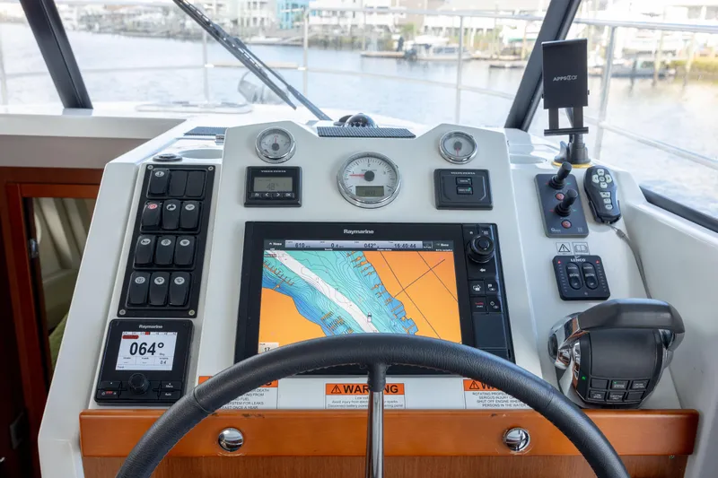 Smooth Yacht Photos Pics Beneteau Swift Trawler 30 helm with navigation system, 2019 model.