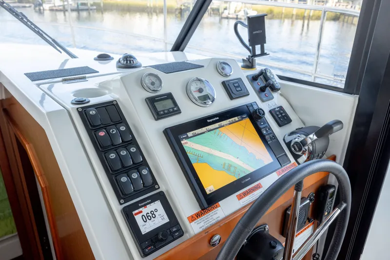 Smooth Yacht Photos Pics 2019 Beneteau Swift Trawler 30 helm with navigation system and controls.