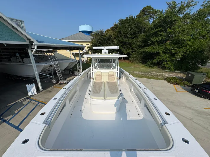  Yacht Photos Pics 2022 Invincible 40 Catamaran docked, showcasing spacious deck and modern design.