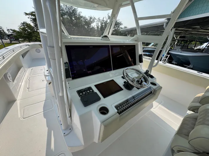  Yacht Photos Pics 2022 Invincible 40 Catamaran helm with dual screens and modern controls.