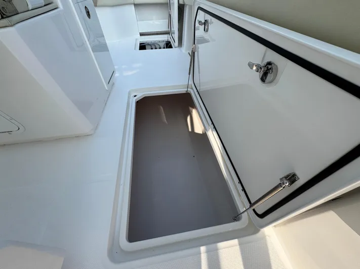 Yacht Photos Pics Open storage compartment on 2022 Invincible 40 Catamaran boat deck.