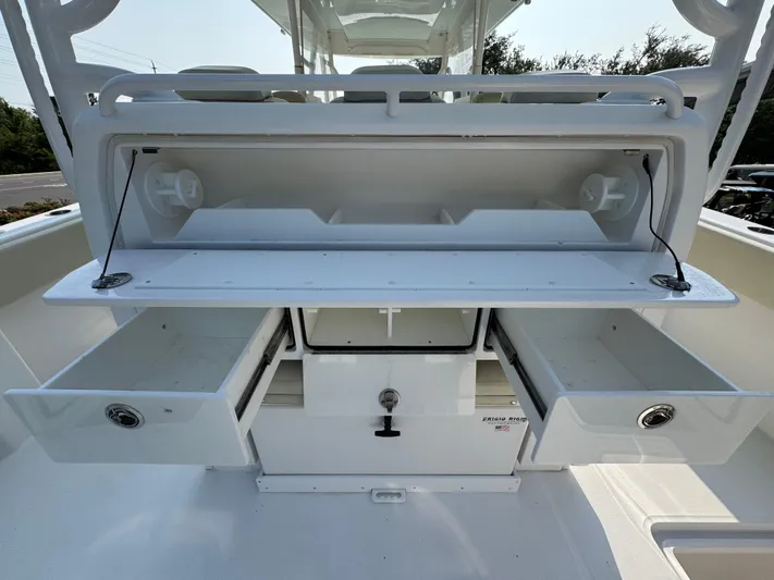  Yacht Photos Pics 2022 Invincible 40 Catamaran storage compartments with open drawers and shelves.