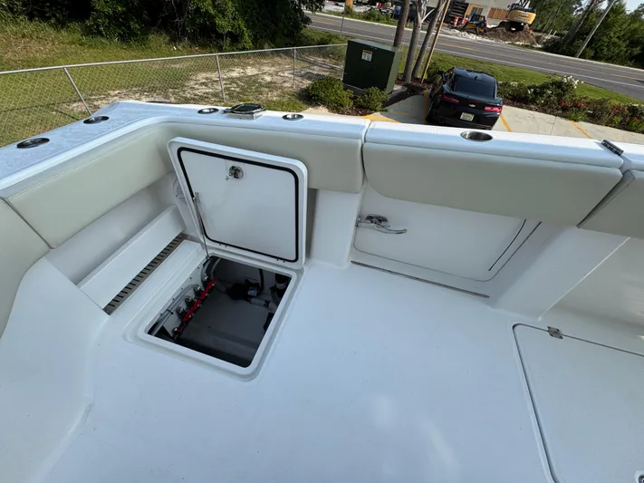  Yacht Photos Pics 2022 Invincible 40 Catamaran deck with open storage compartments.