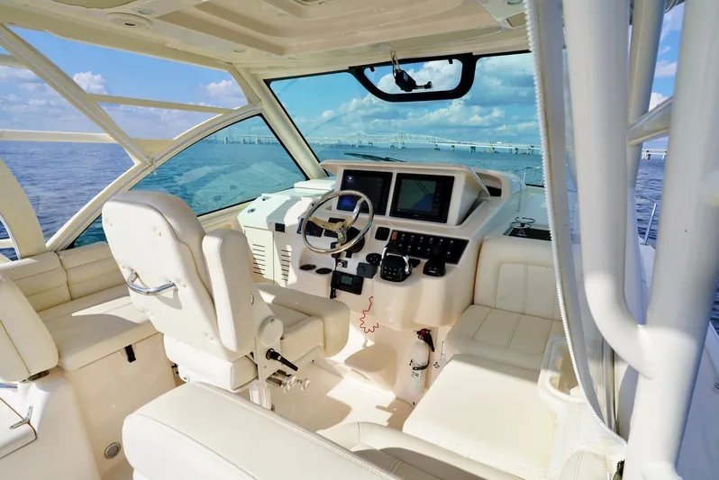  Yacht Photos Pics 2016 Grady-White Express 330 boat interior with helm, steering wheel, and navigation screens.