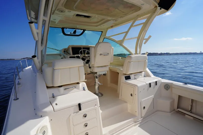  Yacht Photos Pics 2016 Grady-White Express 330 boat interior with helm, seating, and ocean view.