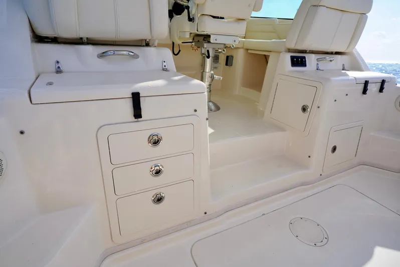  Yacht Photos Pics 2016 Grady-White Express 330 boat interior with storage compartments and seating.