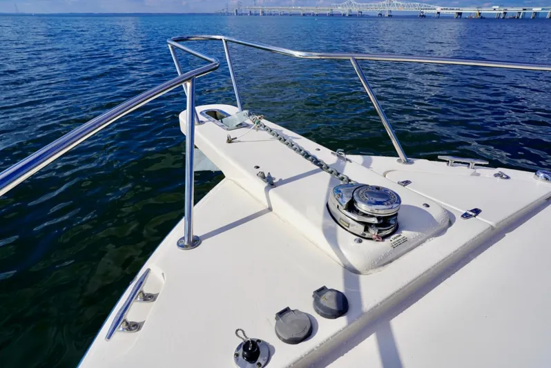  Yacht Photos Pics 2016 Grady-White Express 330 boat deck with anchor, railing, and ocean view.