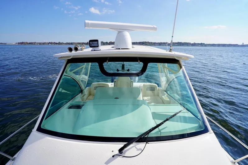  Yacht Photos Pics 2016 Grady-White Express 330 boat on open water, clear sky, front view.