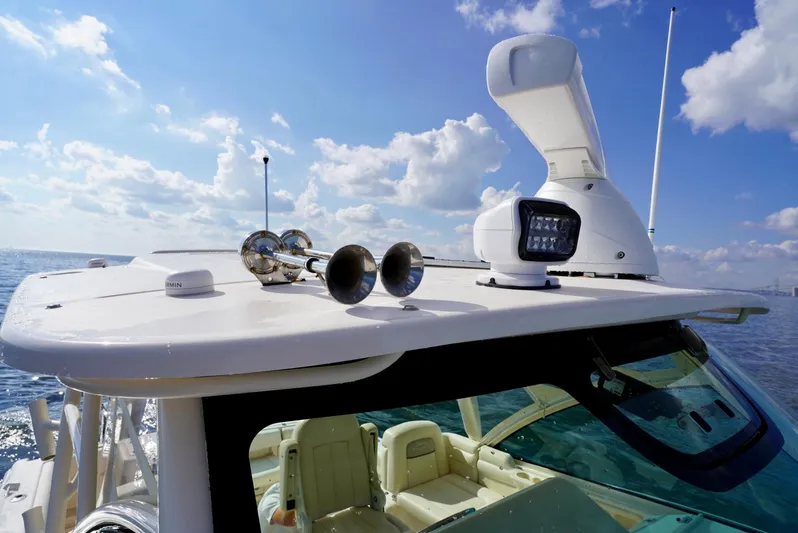  Yacht Photos Pics 2016 Grady-White Express 330 boat with radar and horn on open sea.