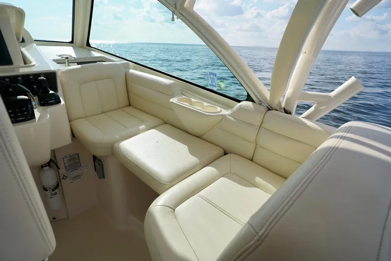  Yacht Photos Pics 2016 Grady-White Express 330 boat interior with cream leather seating, ocean view.