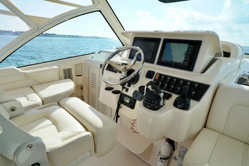  Yacht Photos Pics 2016 Grady-White Express 330 boat cockpit with steering wheel and navigation screens.