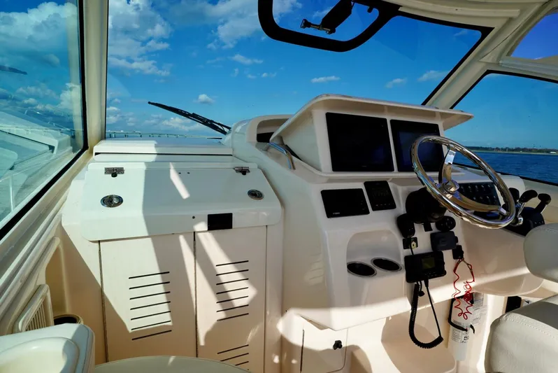  Yacht Photos Pics 2016 Grady-White Express 330 helm with ocean view and clear blue sky.