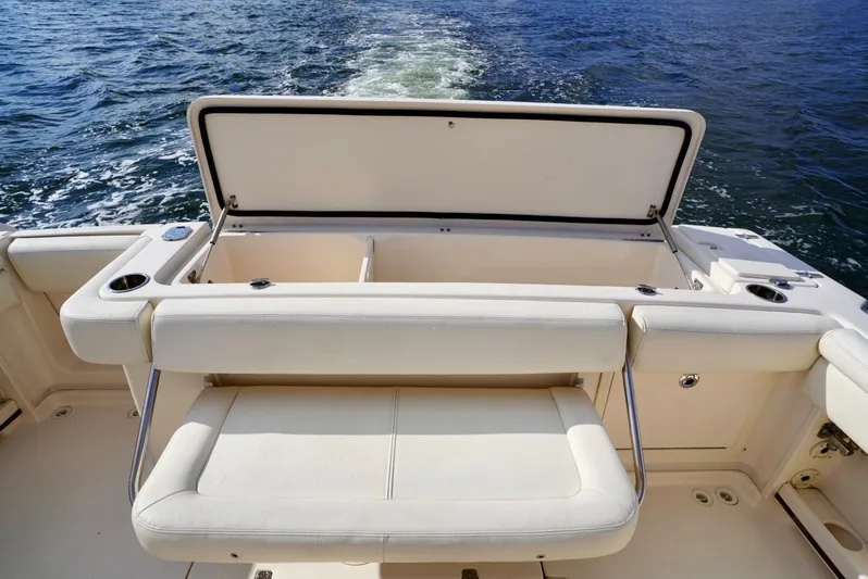  Yacht Photos Pics 2016 Grady-White Express 330 boat with open storage compartment on deck.