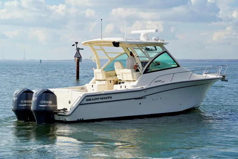  Yacht Photos Pics 2016 Grady-White Express 330 boat on water with twin Yamaha engines.