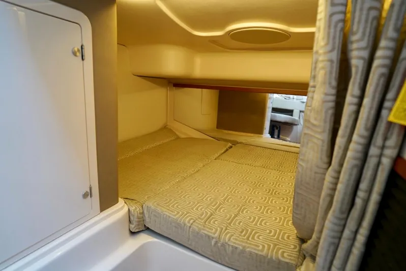  Yacht Photos Pics 2016 Grady-White Express 330 cabin interior with cozy sleeping area and modern design.