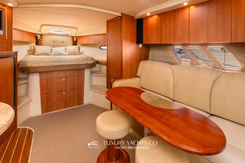  Yacht Photos Pics Luxurious interior of 2009 Cruisers Yachts 360 Express with elegant wood finishes and cozy seating.
