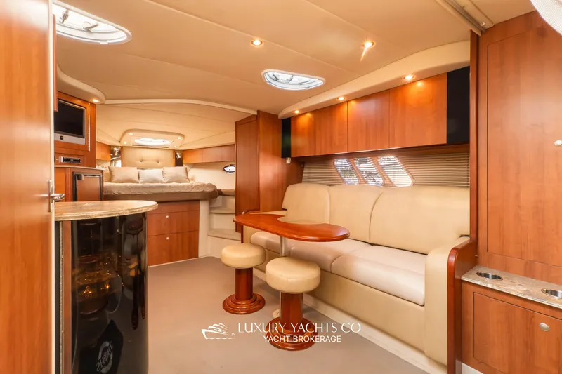  Yacht Photos Pics Luxurious interior of 2009 Cruisers Yachts 360 Express with elegant seating and wood finishes.