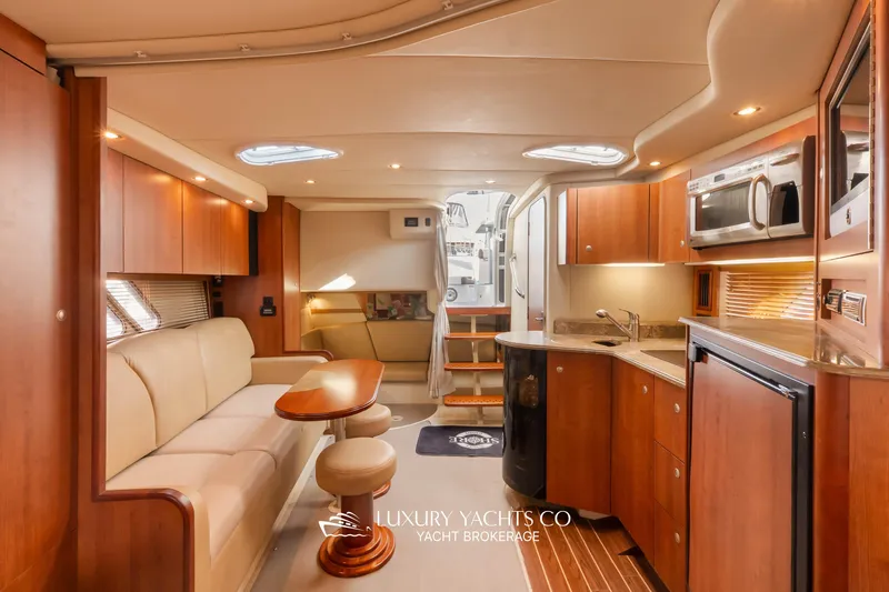  Yacht Photos Pics Luxurious interior of 2009 Cruisers Yachts 360 Express with modern kitchen and seating area.