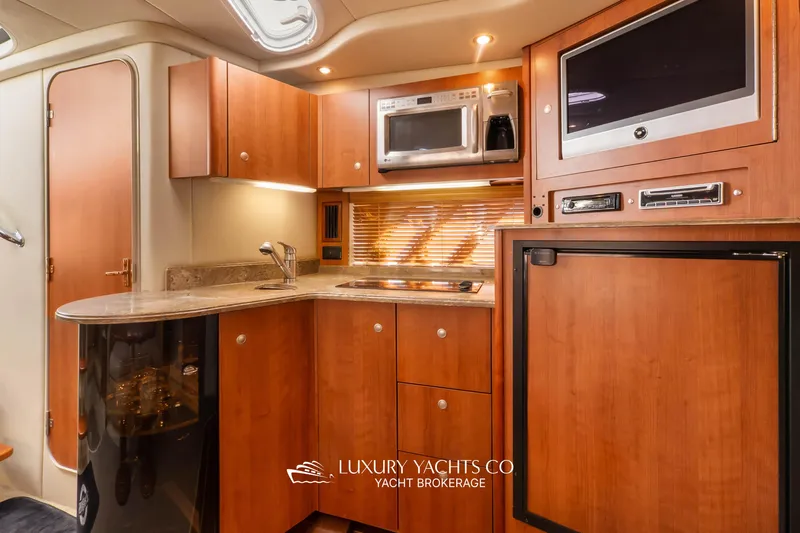  Yacht Photos Pics Luxurious 2009 Cruisers Yachts 360 Express interior kitchen with modern amenities.