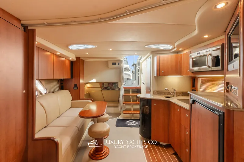  Yacht Photos Pics Luxurious interior of 2009 Cruisers Yachts 360 Express with modern kitchen and seating area.