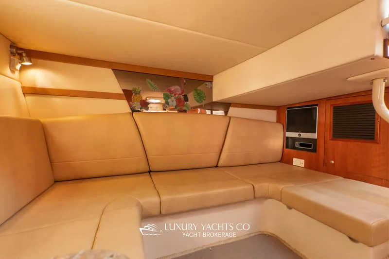  Yacht Photos Pics Luxurious interior of 2009 Cruisers Yachts 360 Express with beige seating and wood accents.