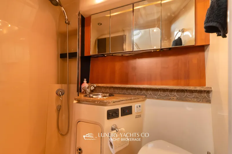  Yacht Photos Pics Luxurious bathroom in 2009 Cruisers Yachts 360 Express with elegant fixtures and wood accents.