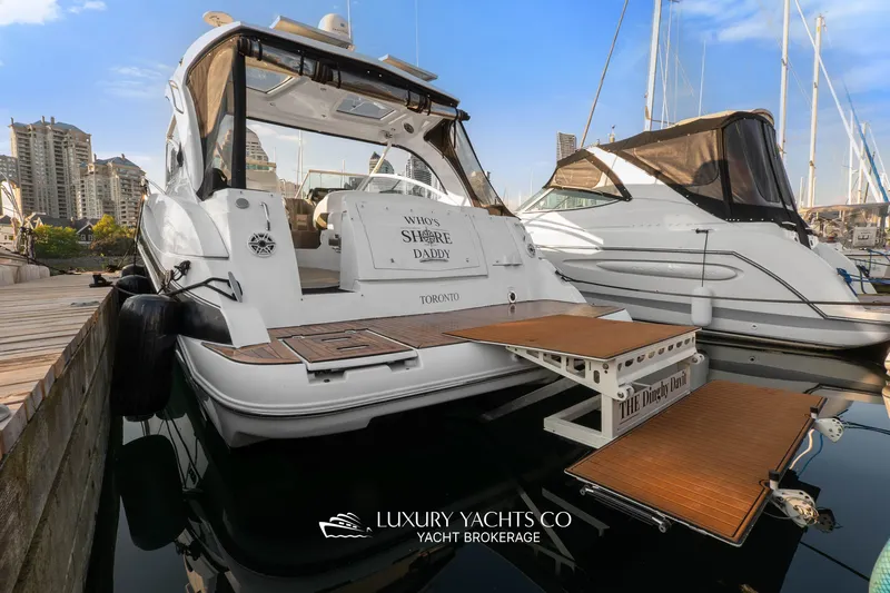  Yacht Photos Pics 2009 Cruisers Yachts 360 Express docked, featuring spacious deck and elegant design.