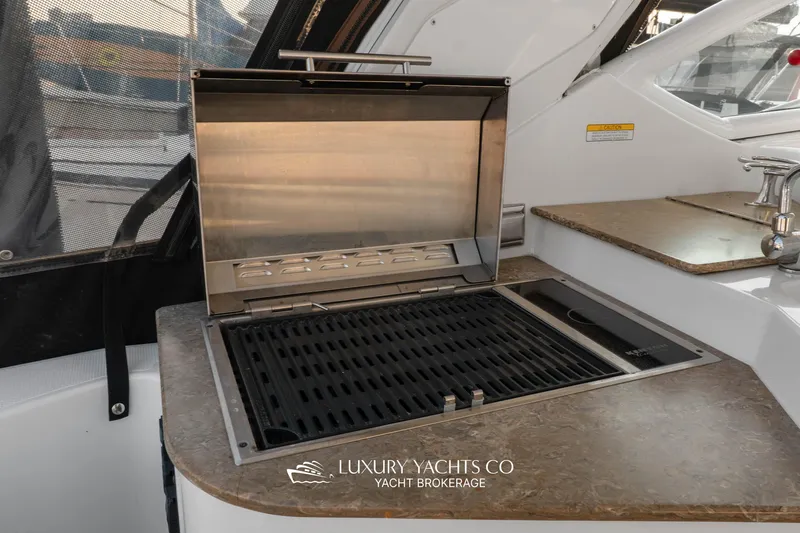  Yacht Photos Pics Outdoor grill and sink on 2009 Cruisers Yachts 360 Express.