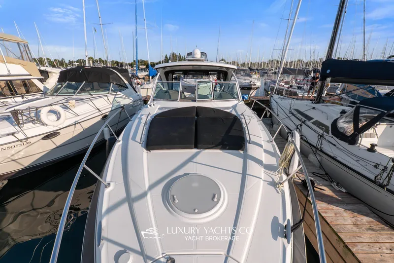  Yacht Photos Pics 2009 Cruisers Yachts 360 Express docked among other boats in a marina.