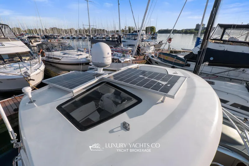  Yacht Photos Pics 2009 Cruisers Yachts 360 Express with solar panels docked at marina.