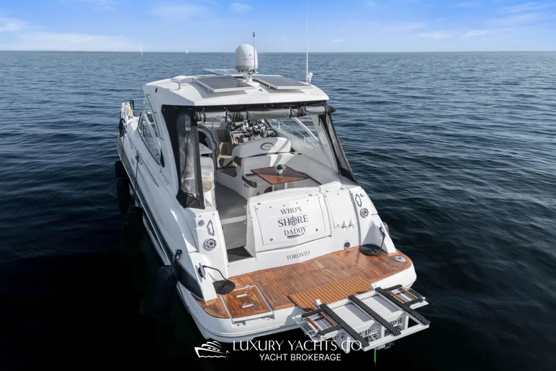  Yacht Photos Pics 2009 Cruisers Yachts 360 Express on open water, rear view, sunny day.