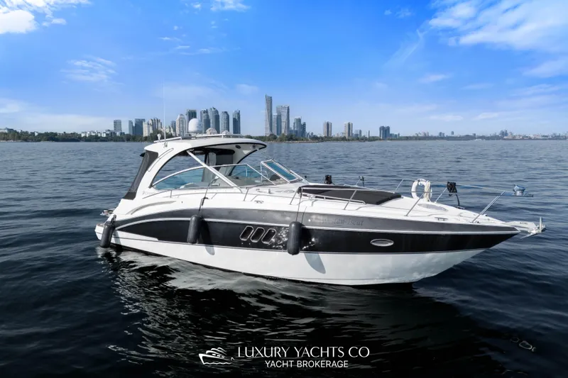  Yacht Photos Pics 2009 Cruisers Yachts 360 Express on water with city skyline in background.