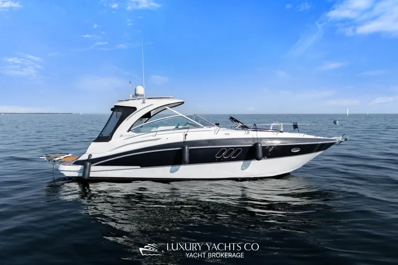  Yacht Photos Pics 2009 Cruisers Yachts 360 Express on calm water under clear blue sky.