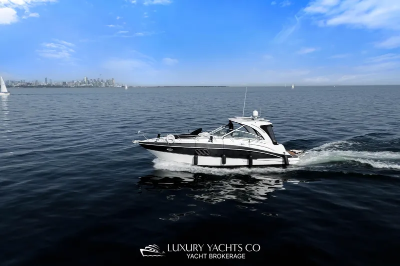  Yacht Photos Pics 2009 Cruisers Yachts 360 Express cruising on open water under a clear blue sky.