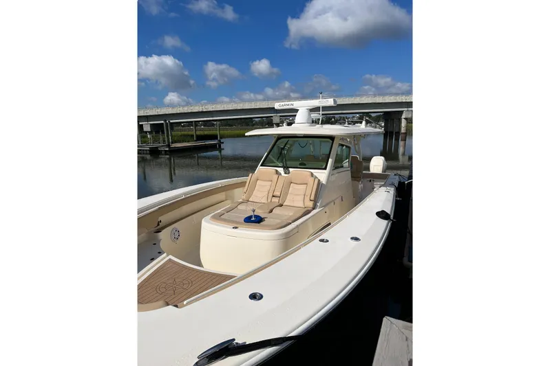  Yacht Photos Pics 2019 Scout 380 LXF boat docked under a clear blue sky.