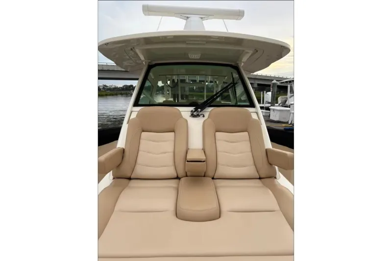  Yacht Photos Pics 2019 Scout 380 LXF boat with luxurious tan seating and sleek design.