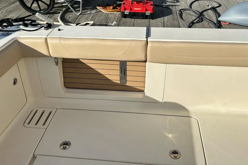  Yacht Photos Pics 2019 Scout 380 LXF boat interior with beige seating and wooden accents.