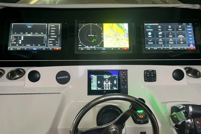  Yacht Photos Pics 2019 Scout 380 LXF dashboard with advanced Garmin navigation displays and controls.