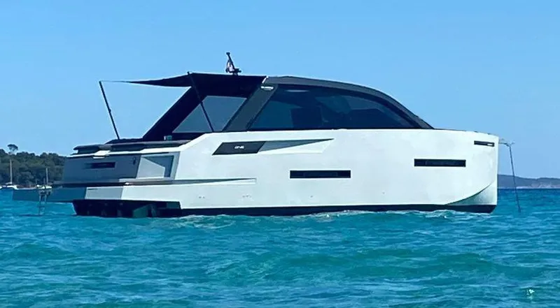  Yacht Photos Pics 2020 De Antonio Yachts D46 Cruiser on calm blue water.