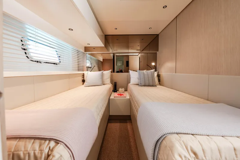 Donnachaidh Yacht Photos Pics Luxurious twin cabin interior on 2020 Sanlorenzo SX76 yacht, featuring modern design and cozy bedding.