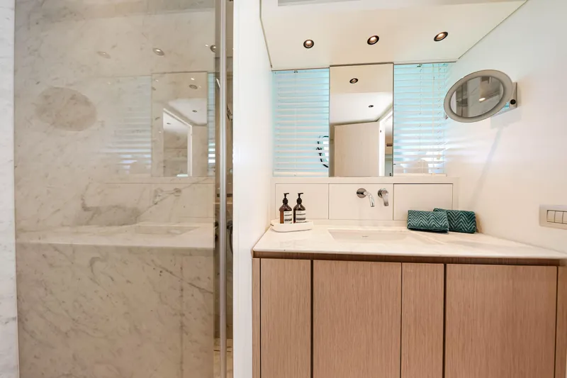 Donnachaidh Yacht Photos Pics Luxurious bathroom on 2020 Sanlorenzo SX76 yacht with modern fixtures and marble shower.