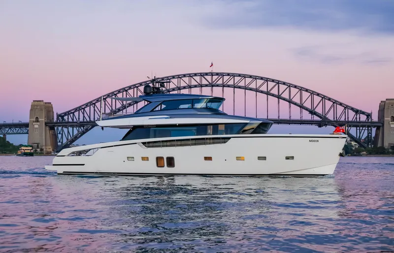 Donnachaidh Yacht Photos Pics Sanlorenzo SX76 yacht cruising near a bridge at sunset, 2020 model.