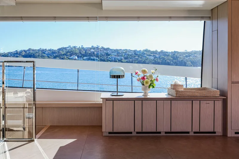 Donnachaidh Yacht Photos Pics Luxurious interior of 2020 Sanlorenzo SX76 yacht with scenic ocean view through large window.