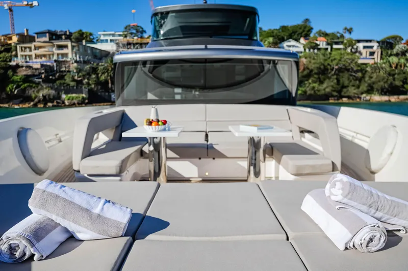 Donnachaidh Yacht Photos Pics Luxurious 2020 Sanlorenzo SX76 yacht deck with seating, tables, and towels.