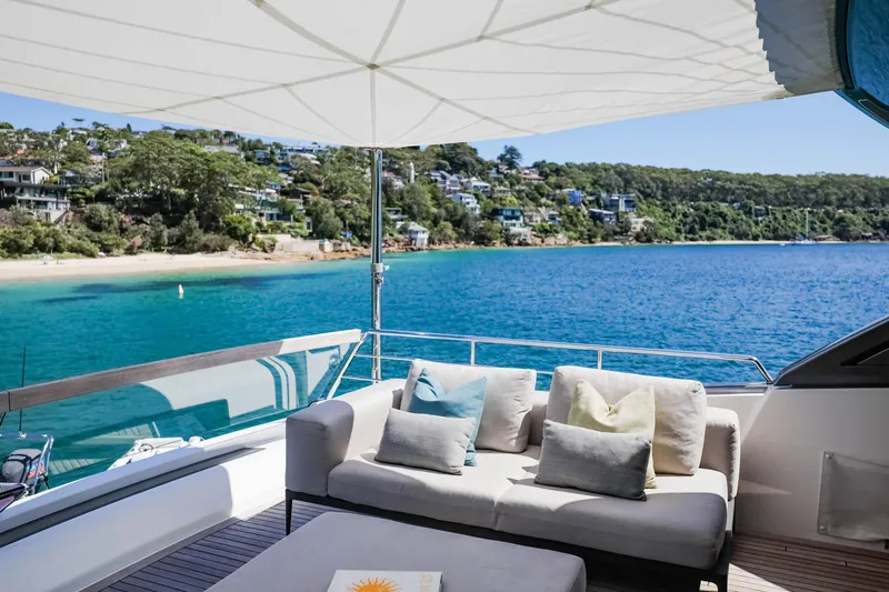 Donnachaidh Yacht Photos Pics Luxurious 2020 Sanlorenzo SX76 yacht with elegant deck, overlooking serene coastal scenery.