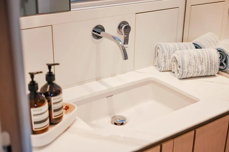 Donnachaidh Yacht Photos Pics Luxury bathroom sink on 2020 Sanlorenzo SX76 yacht with elegant fixtures and toiletries.