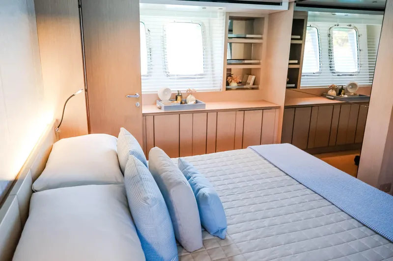 Donnachaidh Yacht Photos Pics Luxurious bedroom interior of 2020 Sanlorenzo SX76 yacht with modern design and elegant furnishings.
