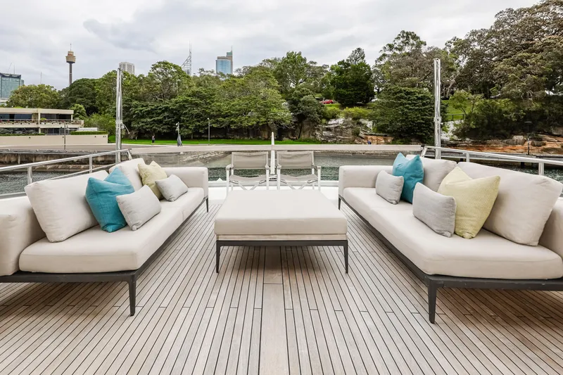 Donnachaidh Yacht Photos Pics Luxury outdoor seating on 2020 Sanlorenzo SX76 yacht deck, with scenic waterfront view.