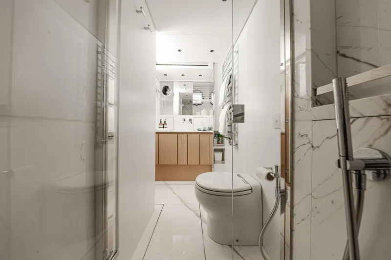 Donnachaidh Yacht Photos Pics Luxurious bathroom on 2020 Sanlorenzo SX76 yacht with modern fixtures and marble accents.